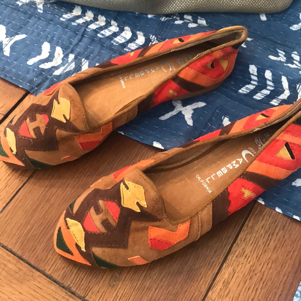 Brightly colored suede shoes with design